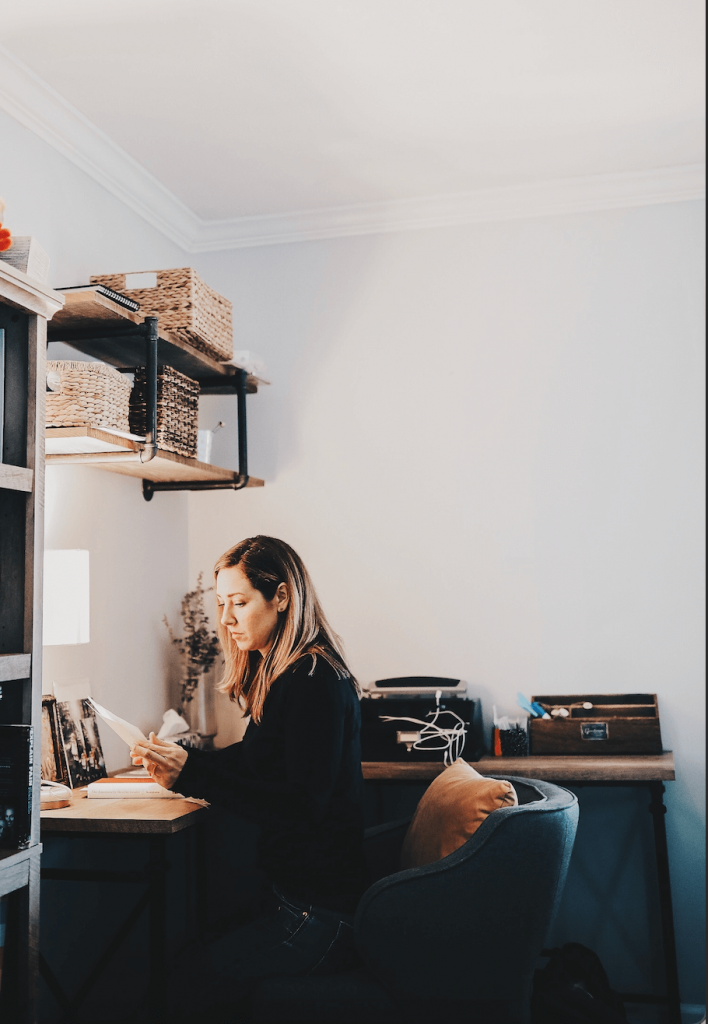 Woman sitting at a desk journaling