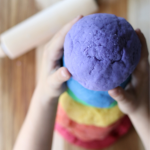 Rainbow colored tower of homemade playdoughj