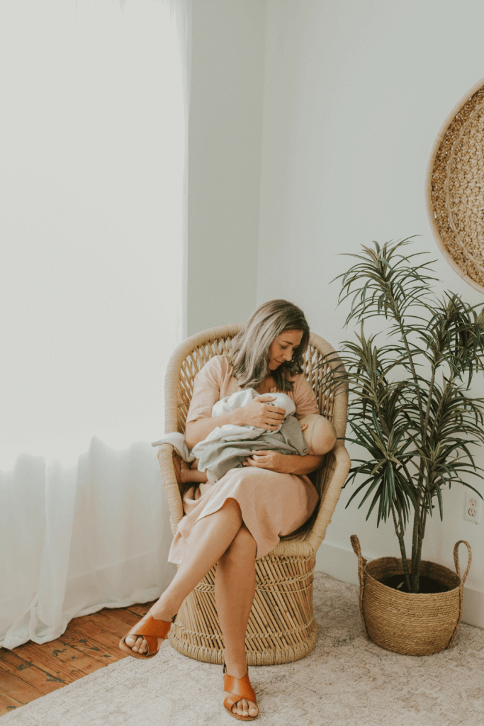 mom nursing baby in a regular dress