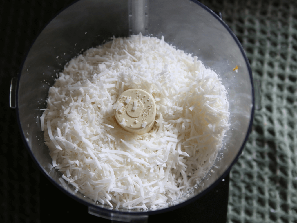 Unsweetened coconut flakes in food processor