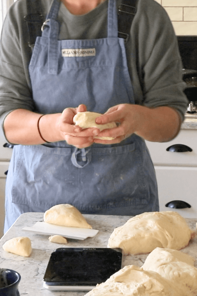soft sourdough hamburger buns being formed