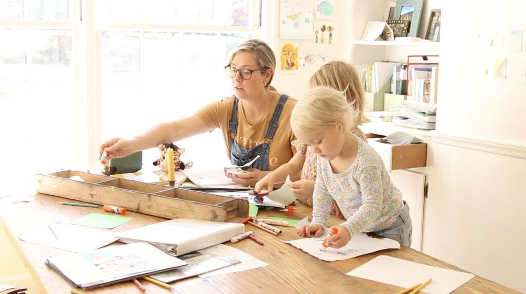 woman homeschooling children