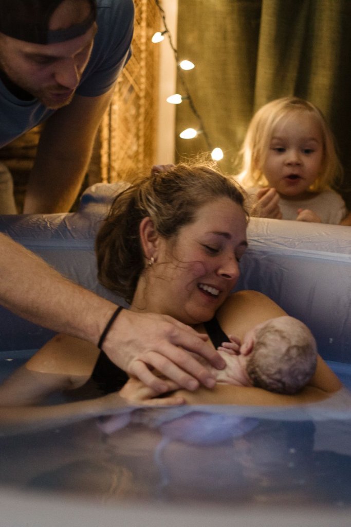 Lana holding newborn