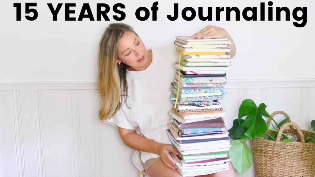 woman with a large stack of journals
