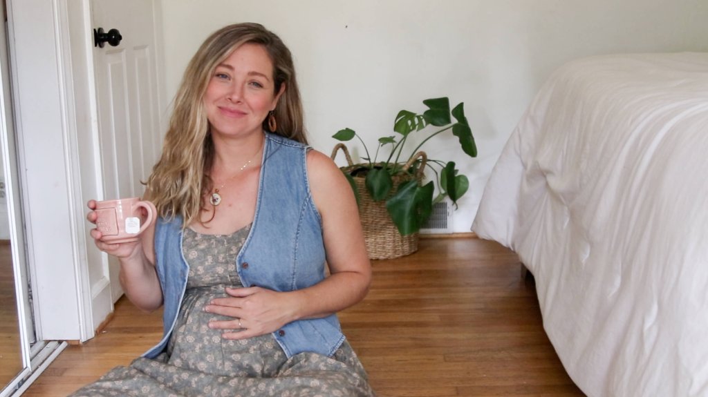 pregnant mom in Neuflora dress with jean vest