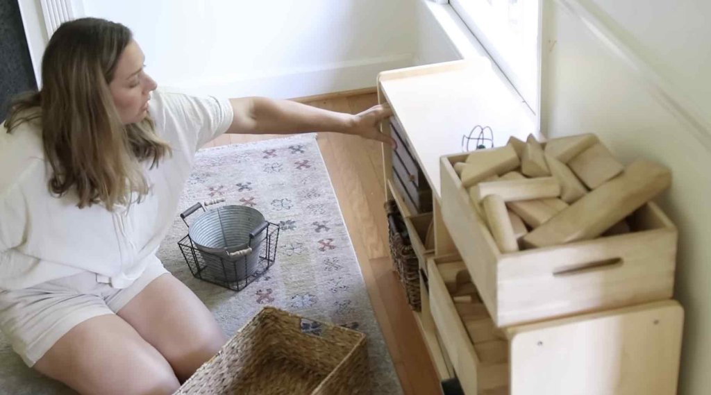 woman organizing toys