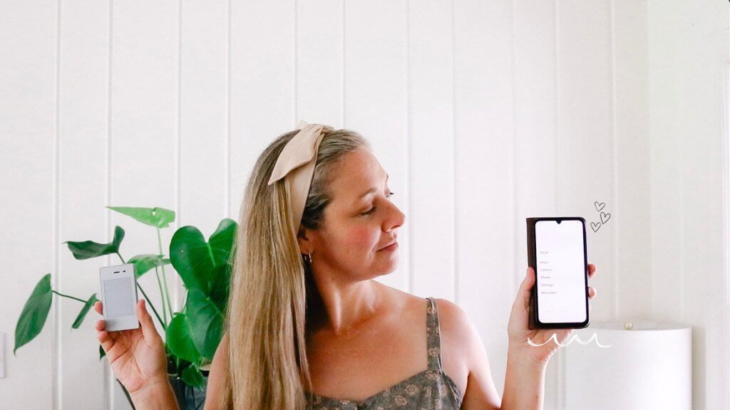 woman holding up a cell phone