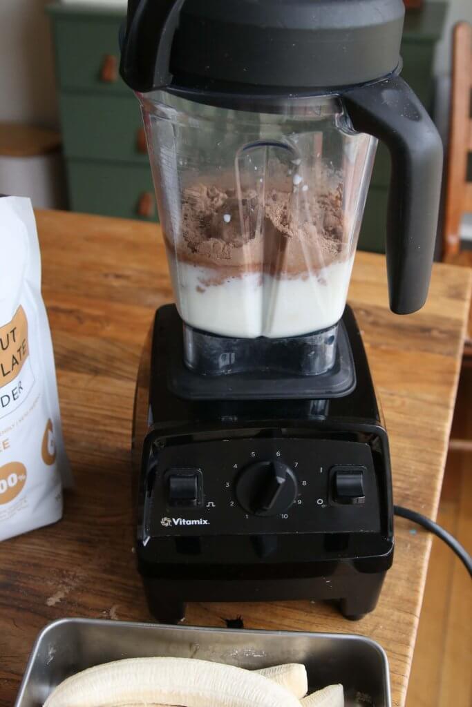 protein powder and milk in blender