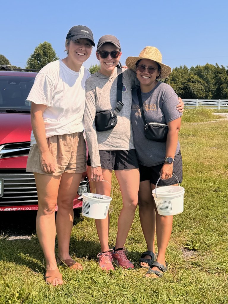 Friends standing together smiling