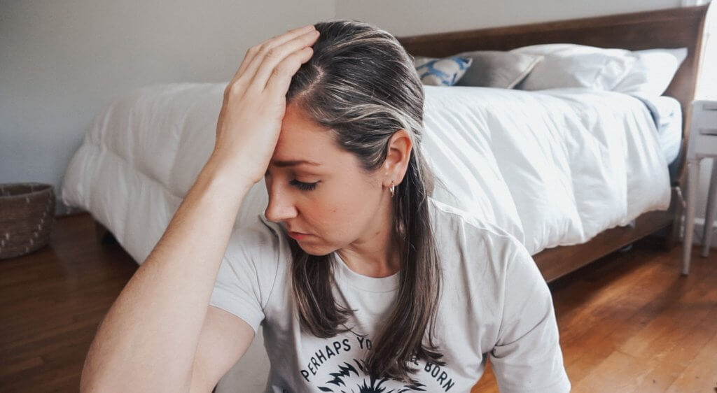 Lana with her hand on her head
