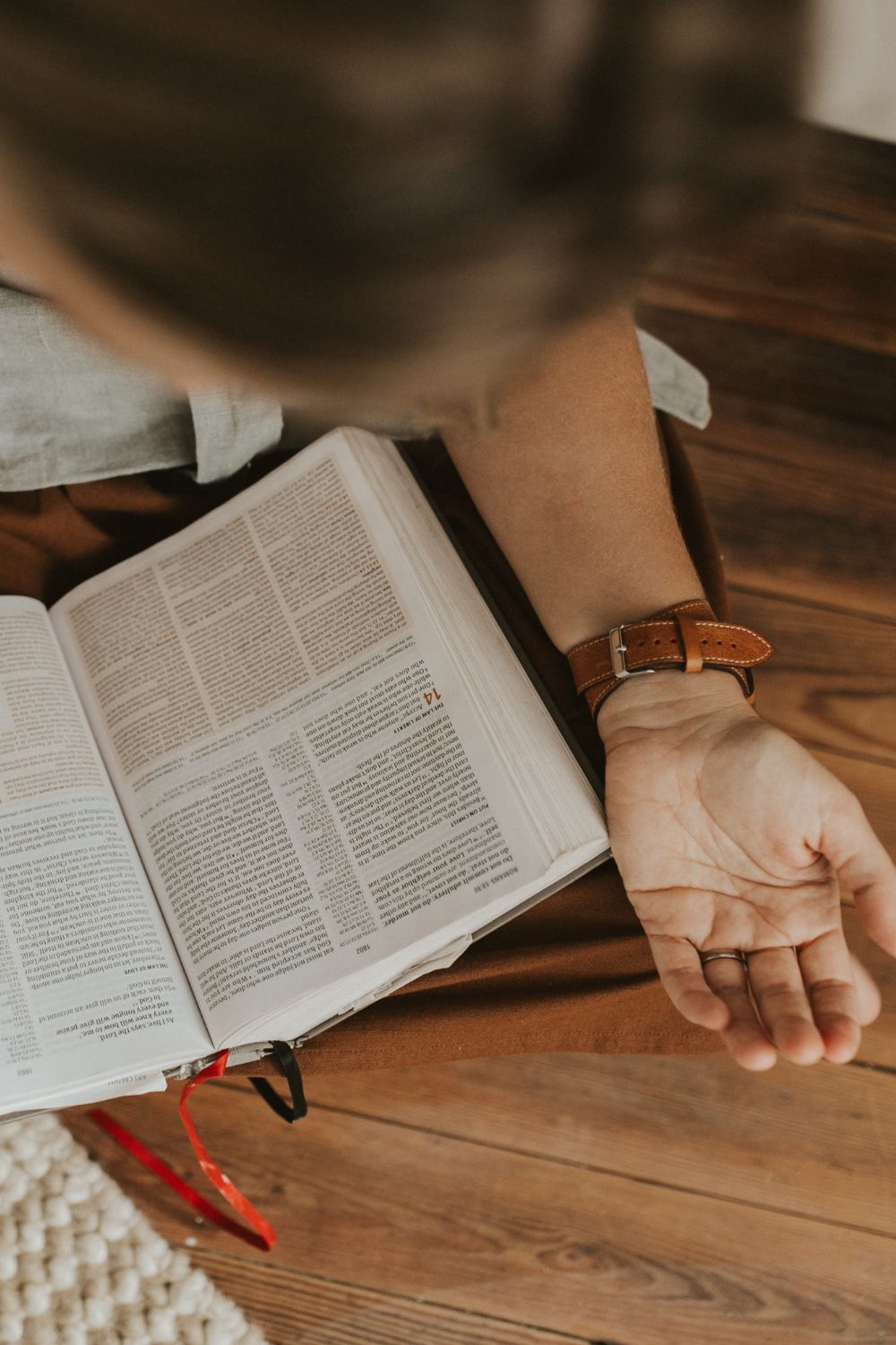 Lana praying with Bible