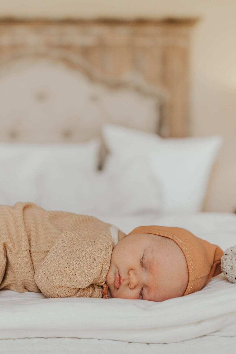 baby sleeping on the bed