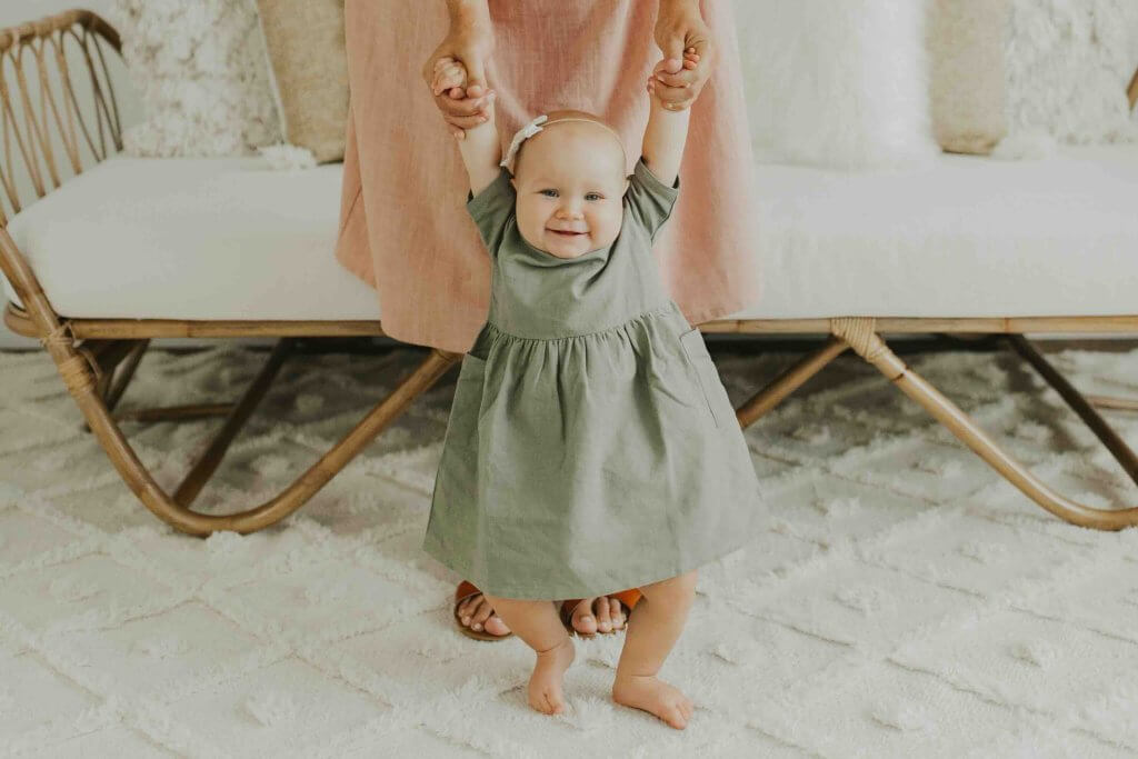 Lana walking with baby
